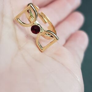 Gold tone red rhinestone bow ring